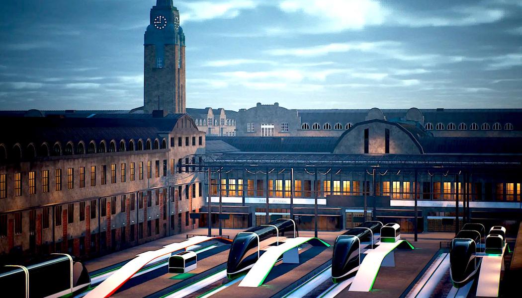 Framtidsvision av Helsingfors centralstation år 2072. Hypersnabba tåg i form av autonoma podder väntar på passagerare.  Kapslarna påminner om en rymdfarkost som skjuts iväg genom en tunnel. Kapseln, eller “podden” som den kallas, svävar en bit ovanför spåret. Ja, den leviterar faktiskt med hjälp av elektromagnetisk teknik även kallas magnetisk levitation (maglev). ZOAN

